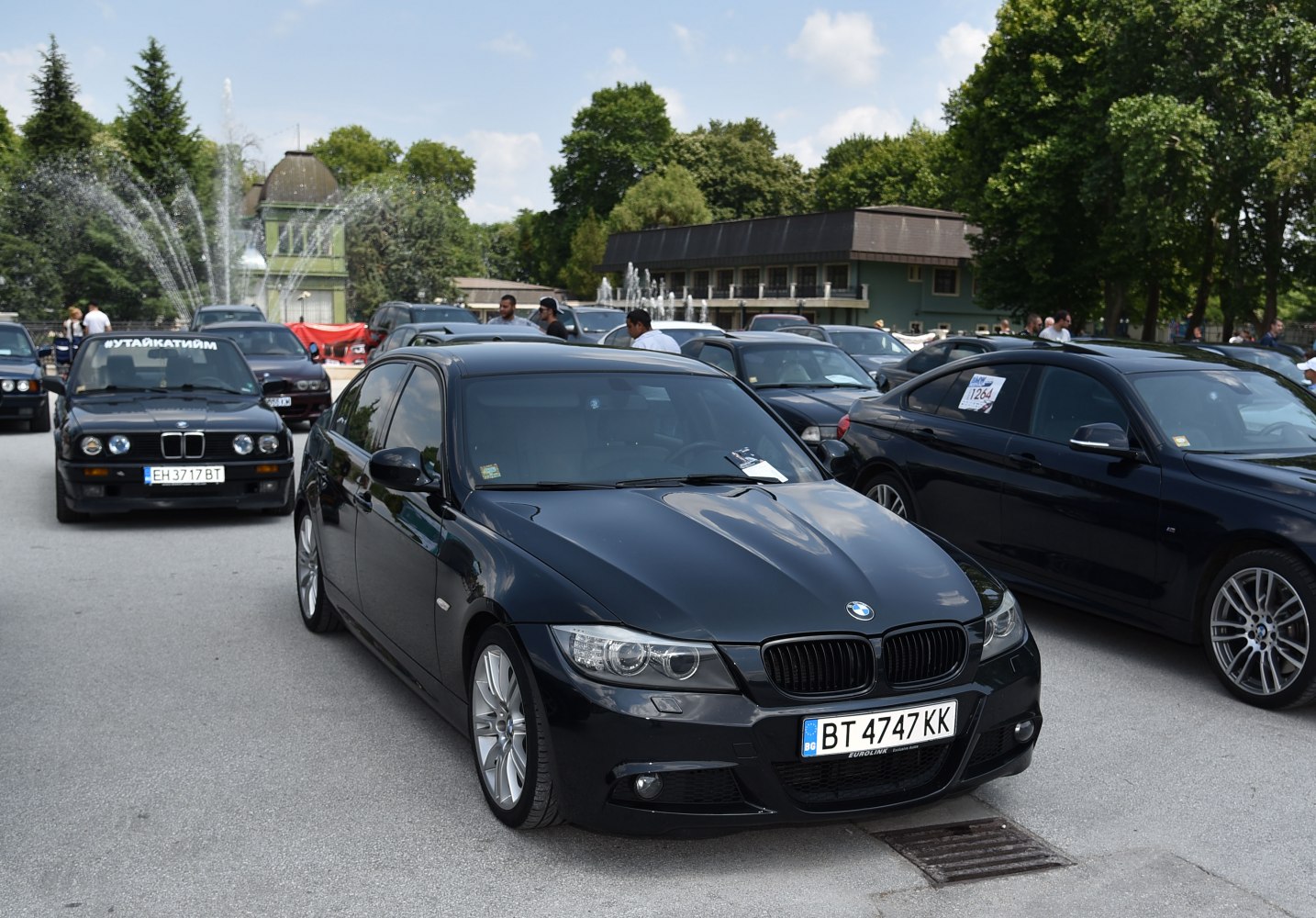Black sedan with updated headlights and kidney grille front