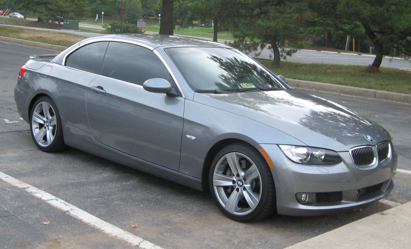 Silver 2-door convertible with alloy wheels and tinted windows