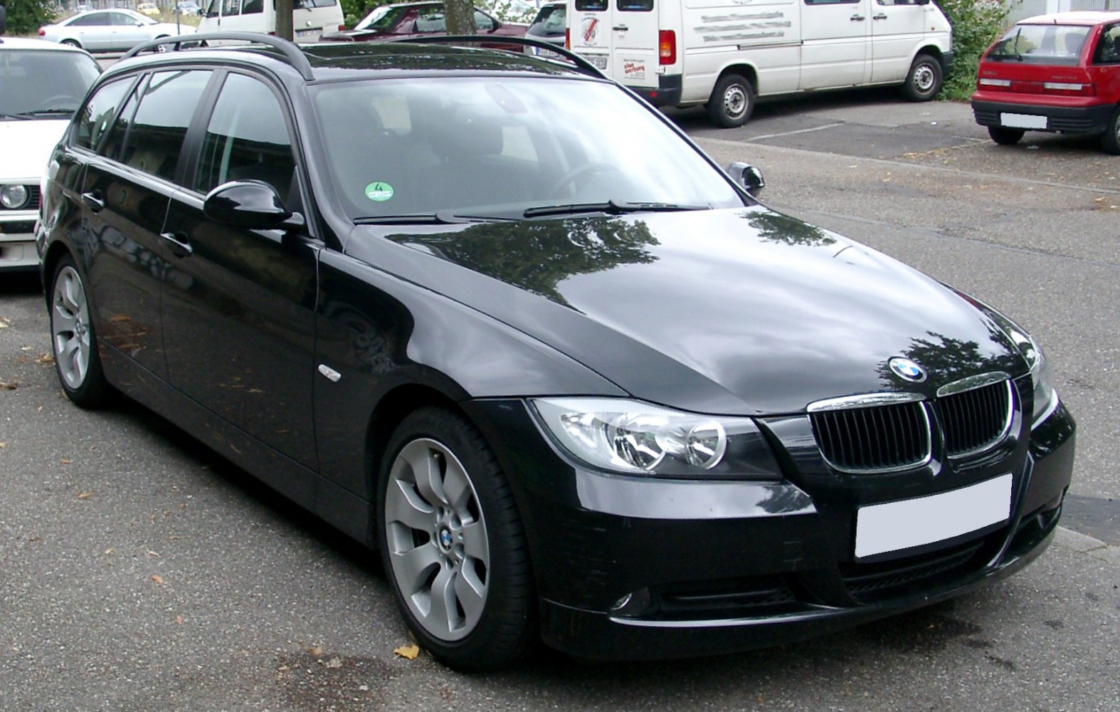 Black modern wagon with alloy wheels and roof rails