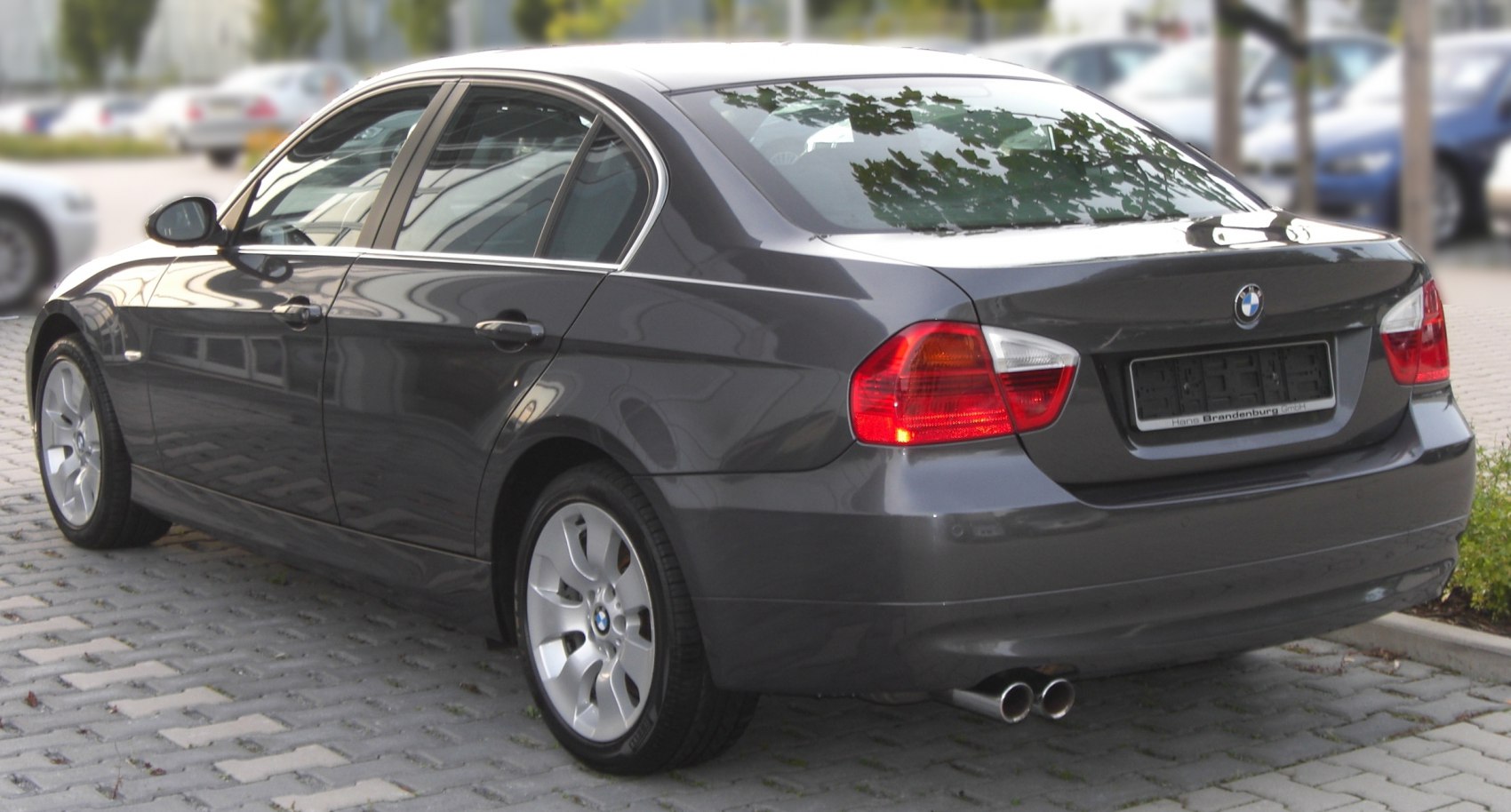 Rear side view with taillights, alloy wheels, and dual exhaust