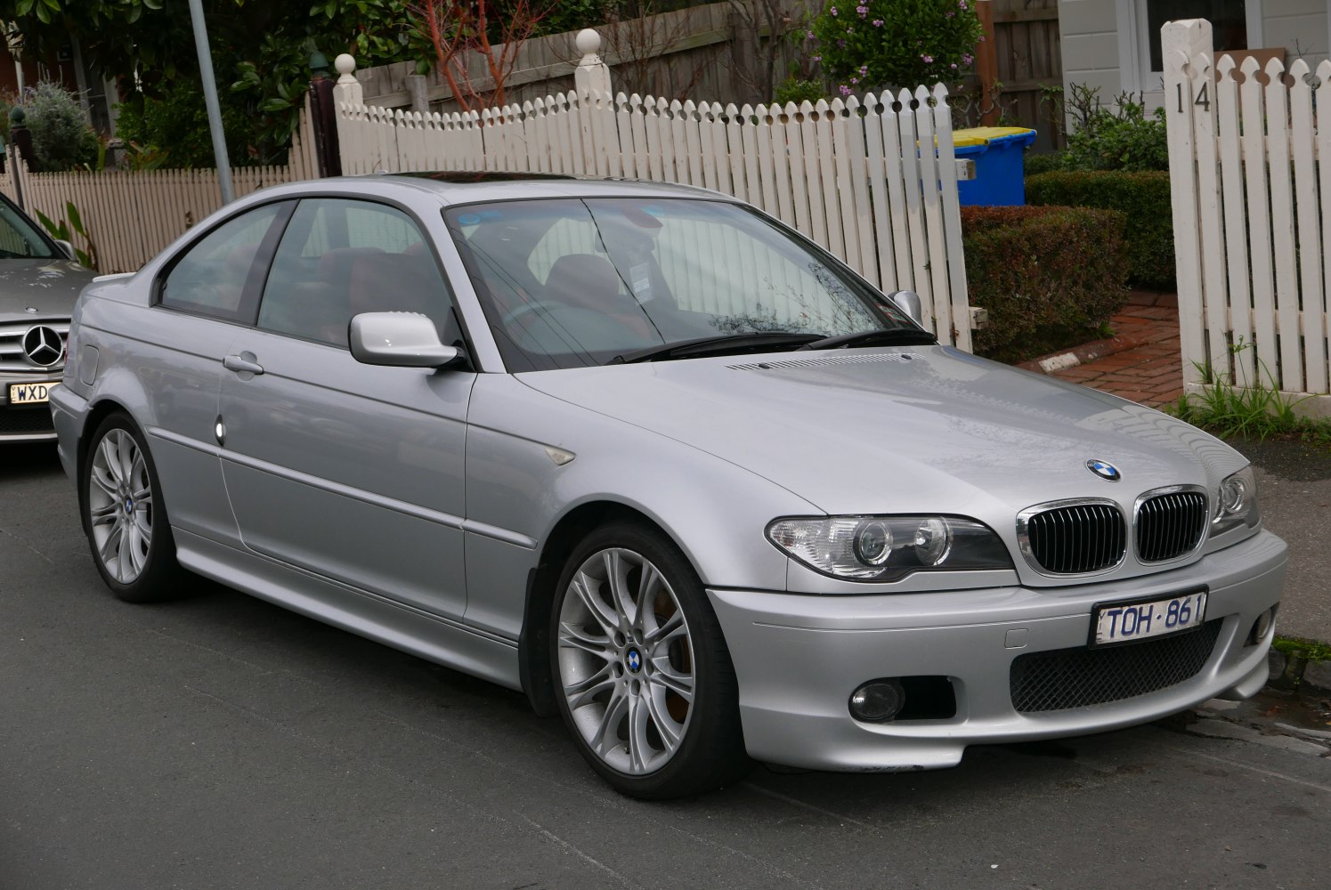 Silver coupe with facelifted headlights and alloy wheels