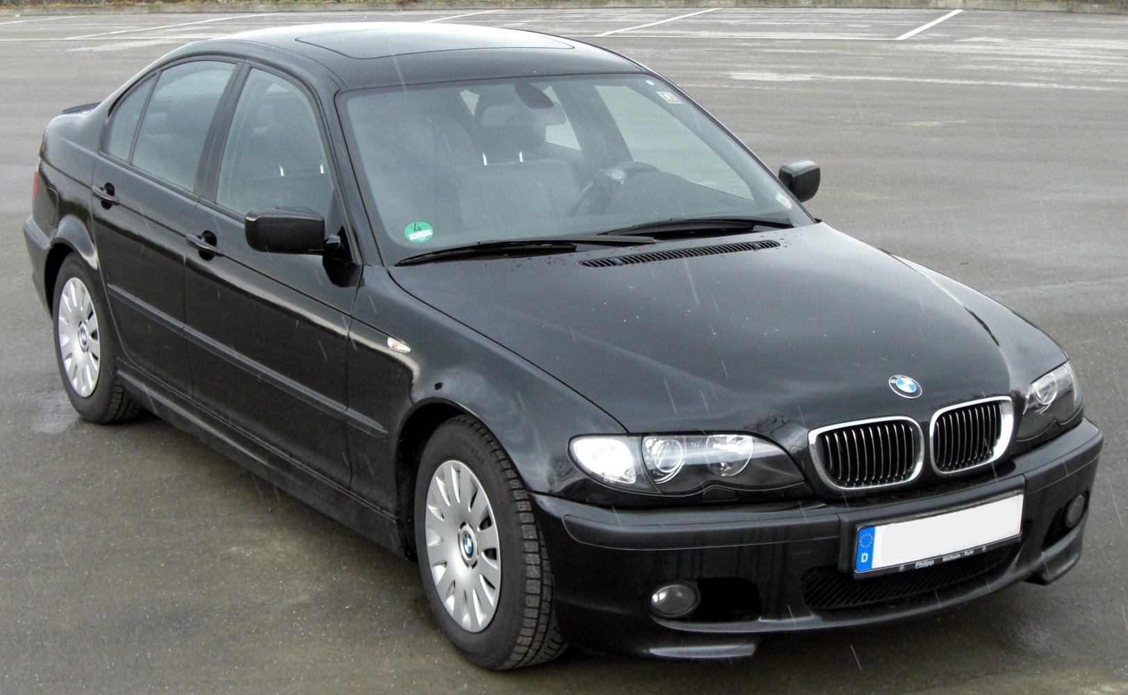 Front angled view showing kidney grille and headlights of a facelifted sedan