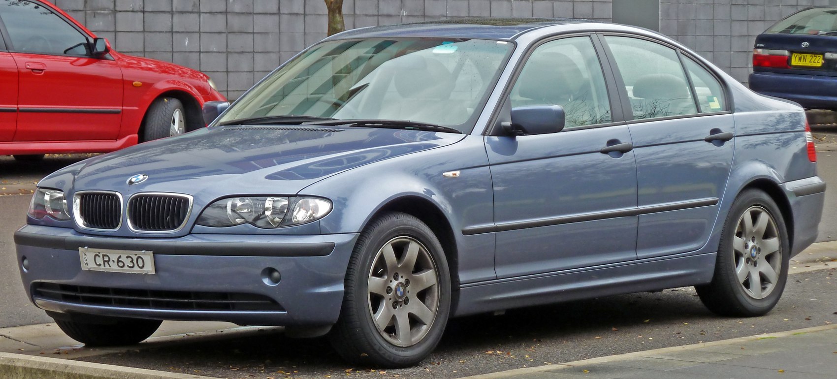 BMW sedan front three-quarter view with signature grille and headlights