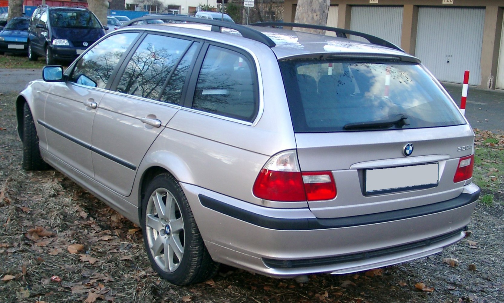 Rear and side view of a station wagon with alloy wheels and roof rails