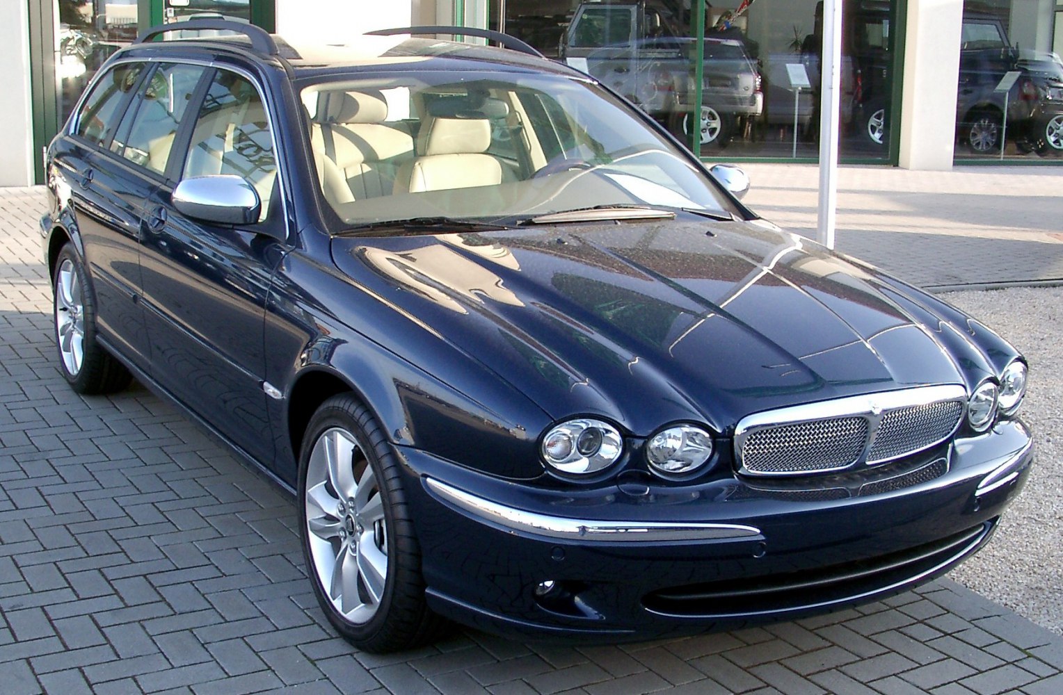 Luxury wagon with distinctive front dual round headlights and chrome grille