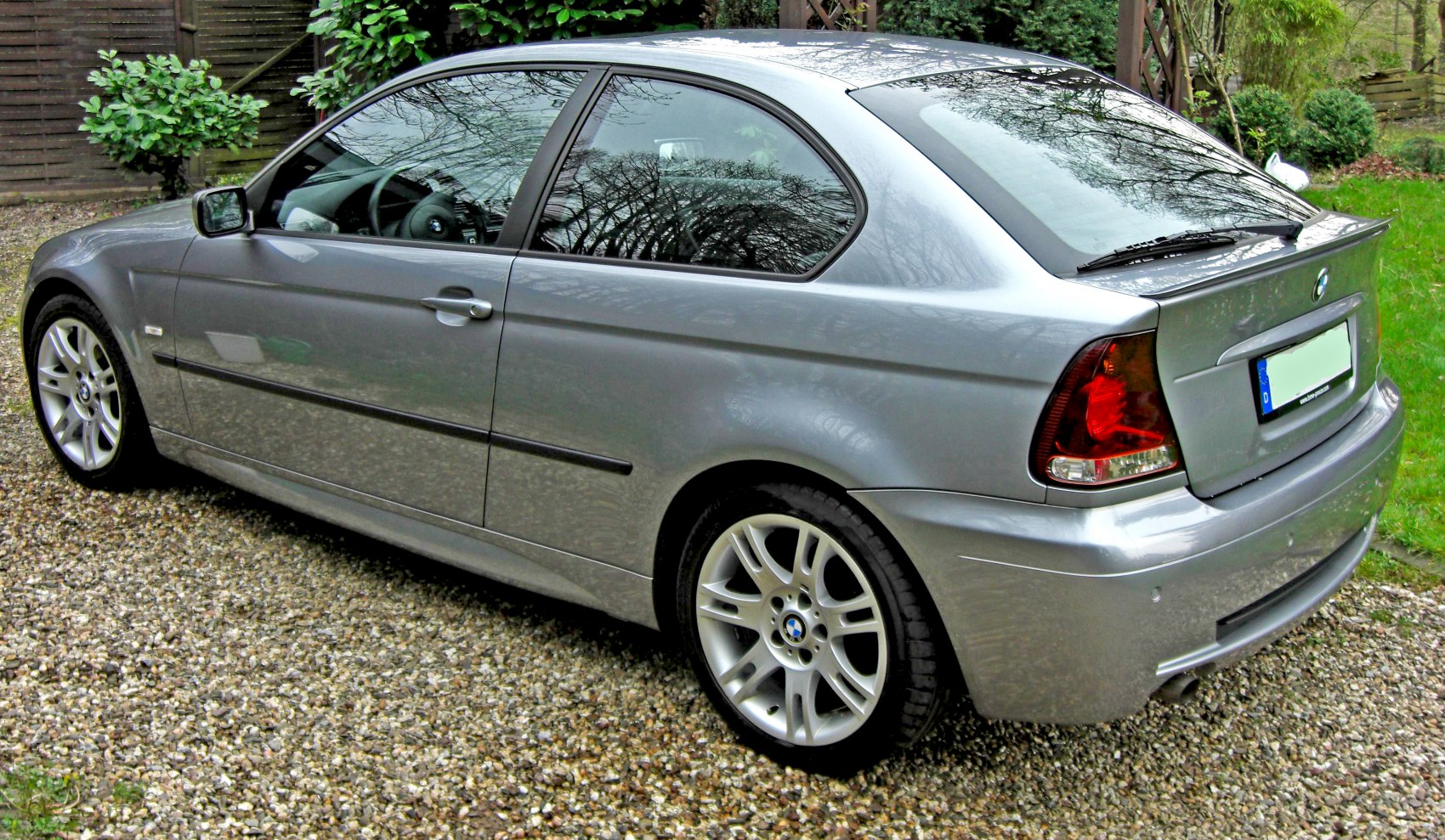 Silver hatchback with rear side view and alloy wheels