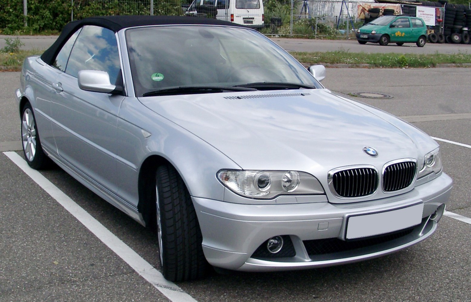 Convertible front angle with soft top roof and distinct headlights
