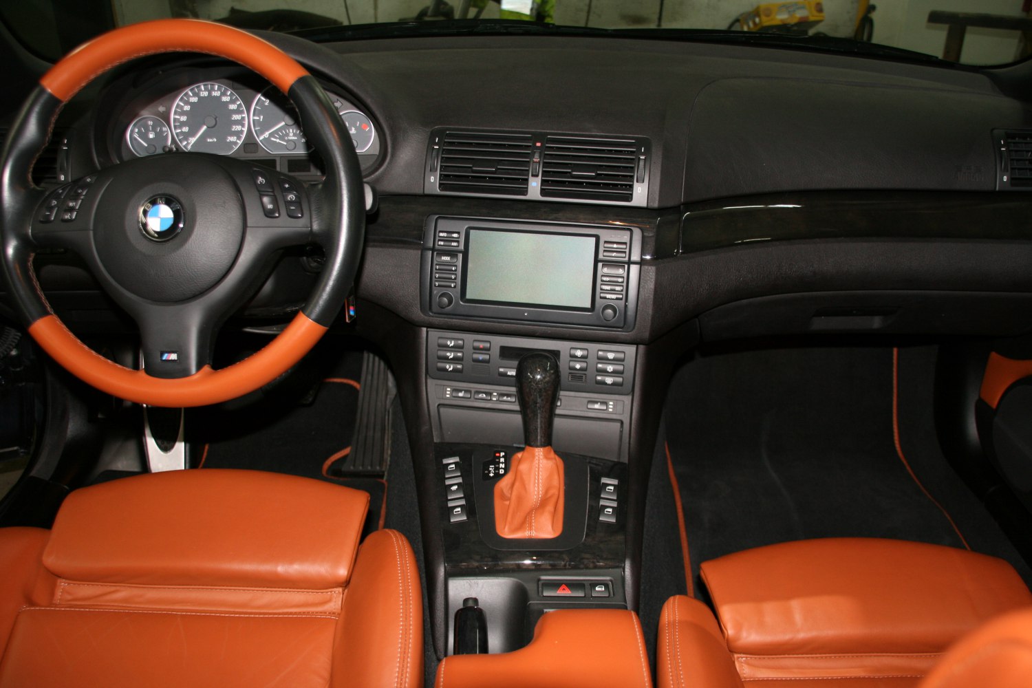 Dashboard, steering wheel, and center console with leather seats