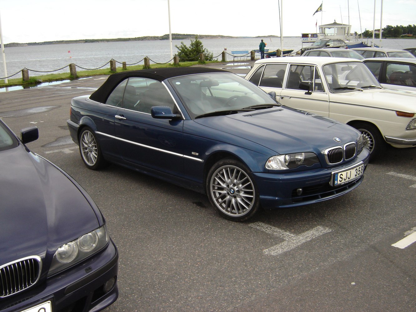 BMW convertible with black soft top and multi-spoke alloy wheels