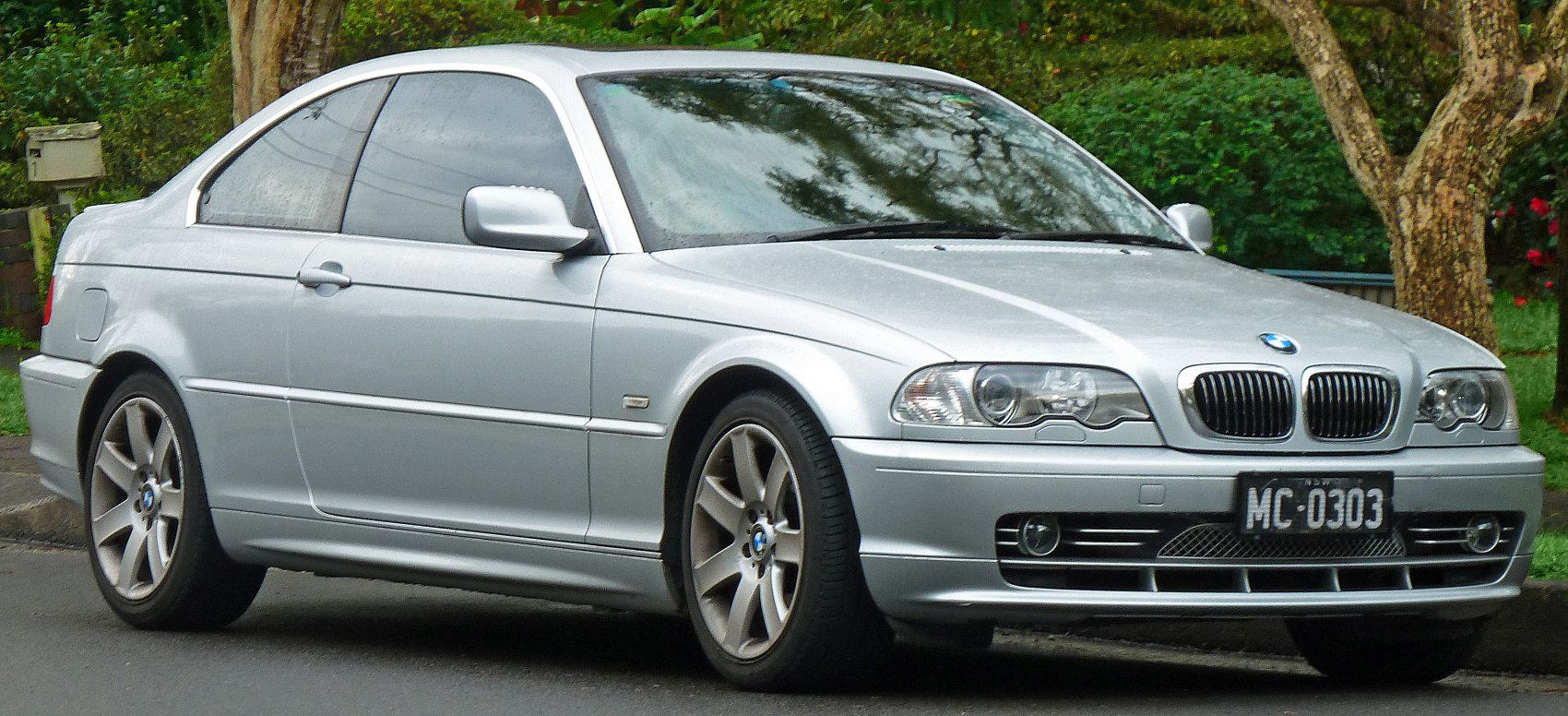 Silver coupe with kidney grille and alloy wheels in front-side view