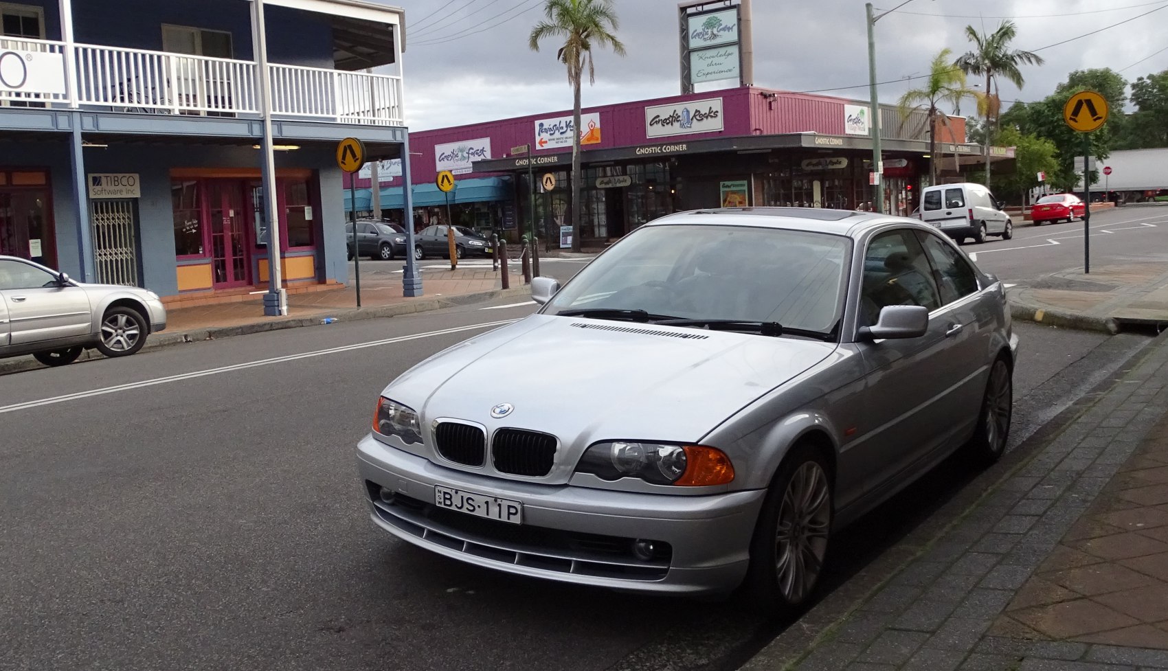 Front view of BMW 3 Series E46 sedan on street