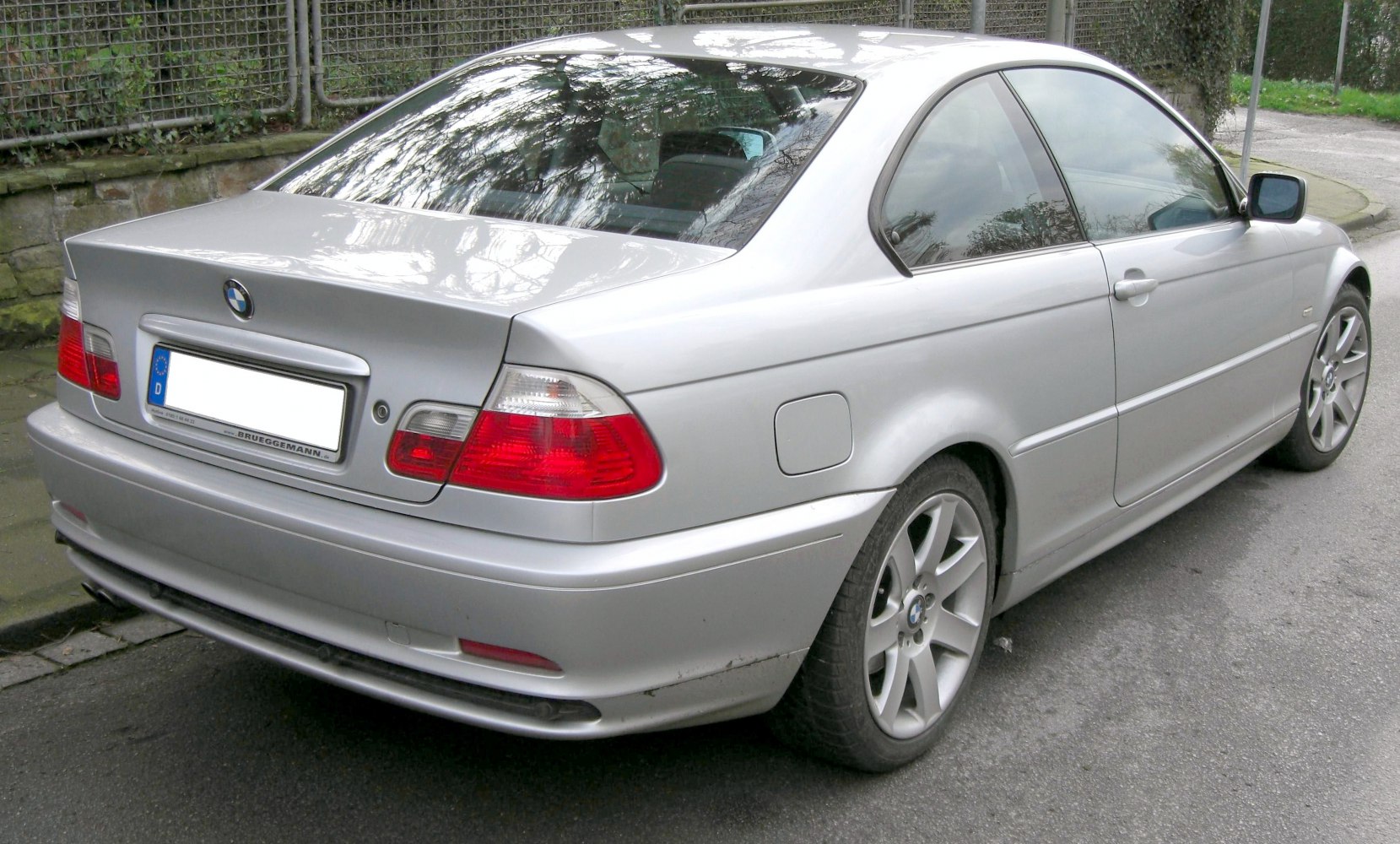 Silver 3 Series coupe rear and side view with tail lights and alloy wheels