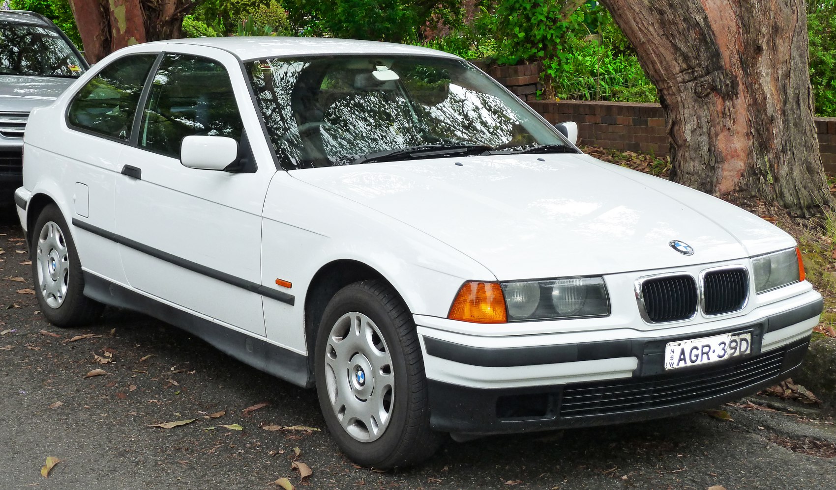 Front side view of classic 1990s coupe with sporty design