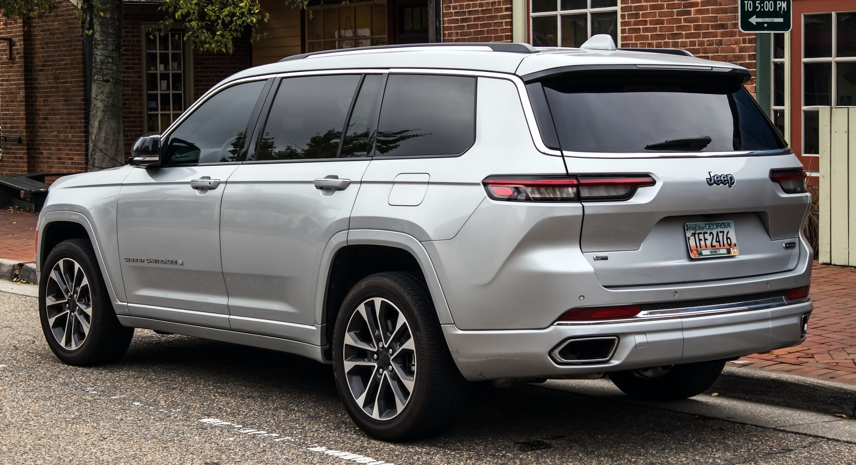 Rear and side view of silver SUV with distinct tail lights and alloy wheels
