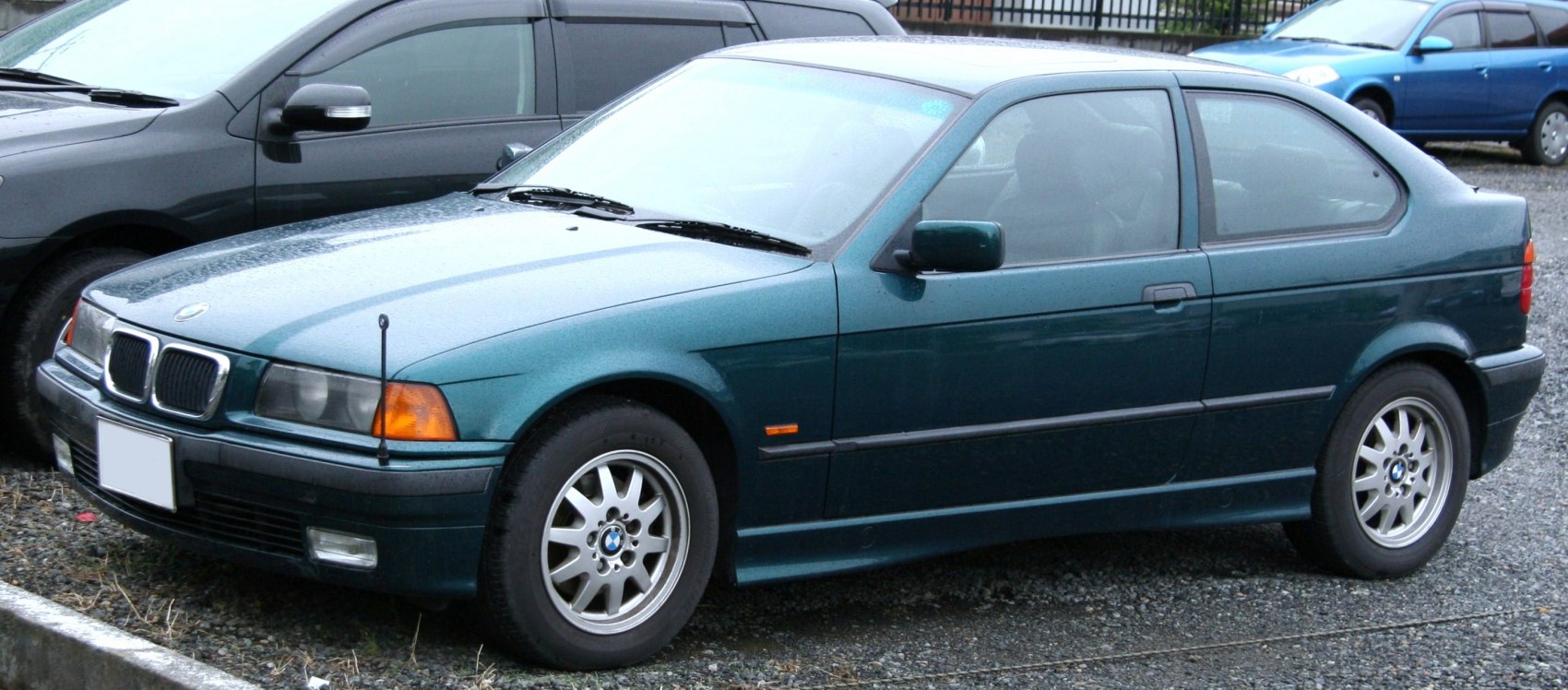 3-door hatchback with alloy wheels and green paint