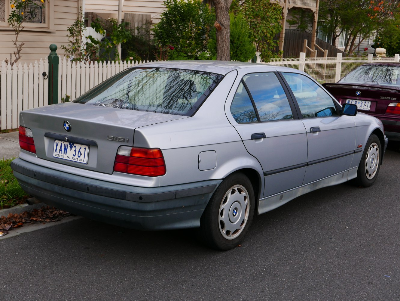 Rear view of classic sedan with distinctive taillights and trunk design