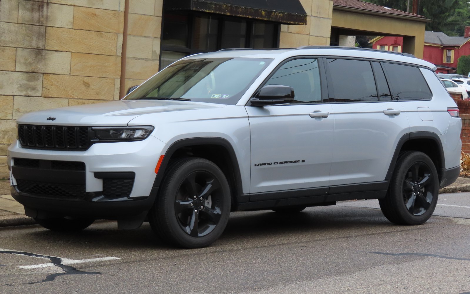 Silver SUV with black grille and black alloy wheels.