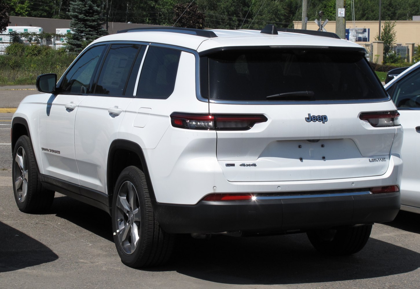 Rear view of SUV with sleek modern tail lights and roof rails