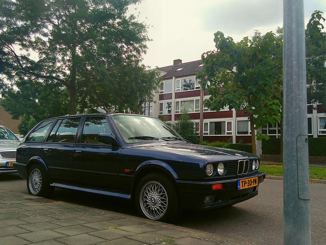 Classic estate car with round headlights and alloy wheels