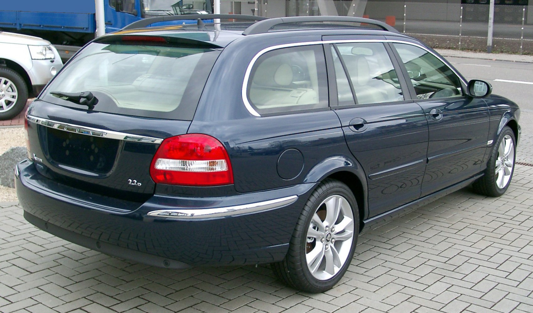 Rear and side profile of a sleek estate car with alloy wheels