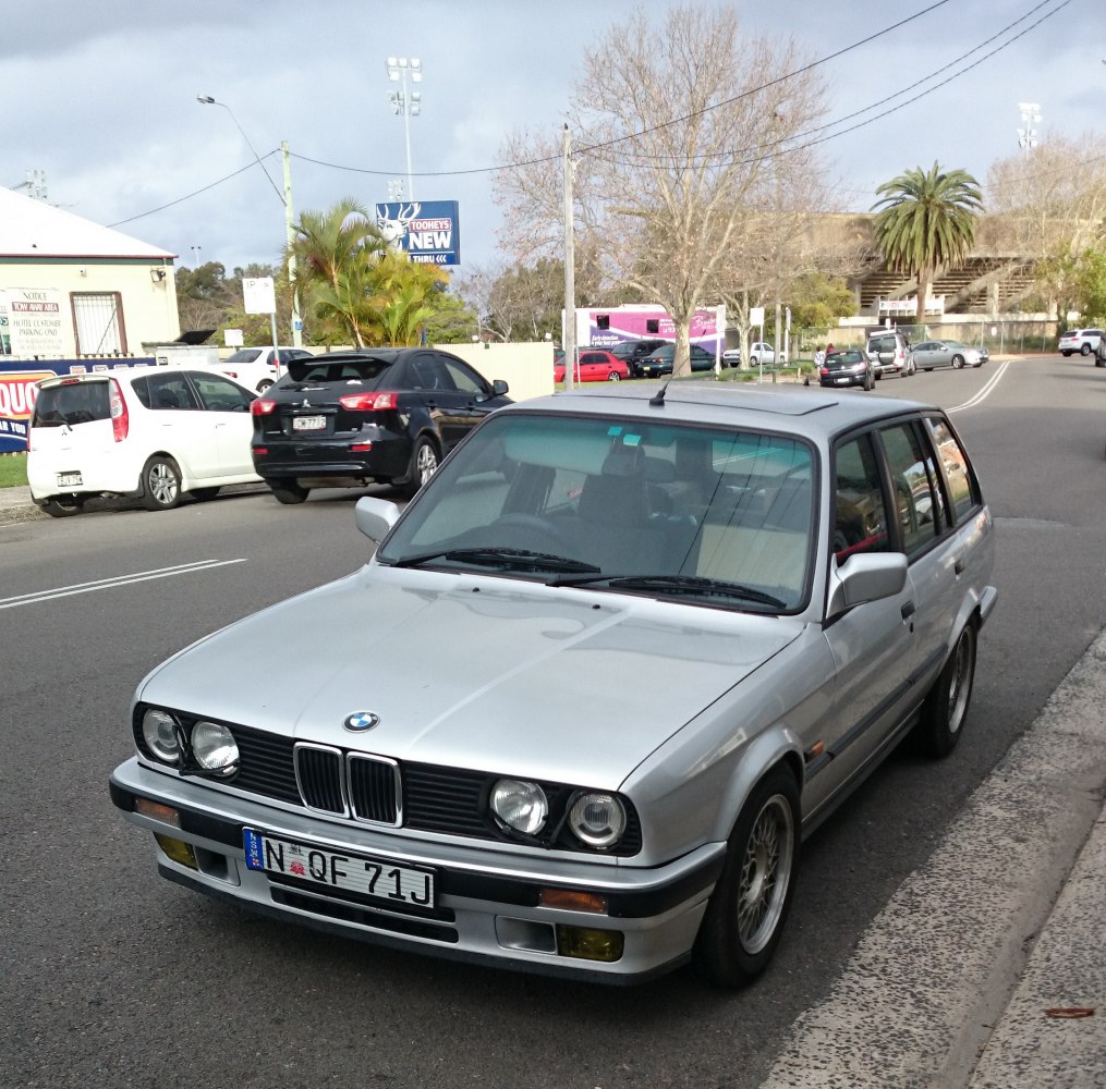 Silver compact wagon with quad headlights and alloy wheels