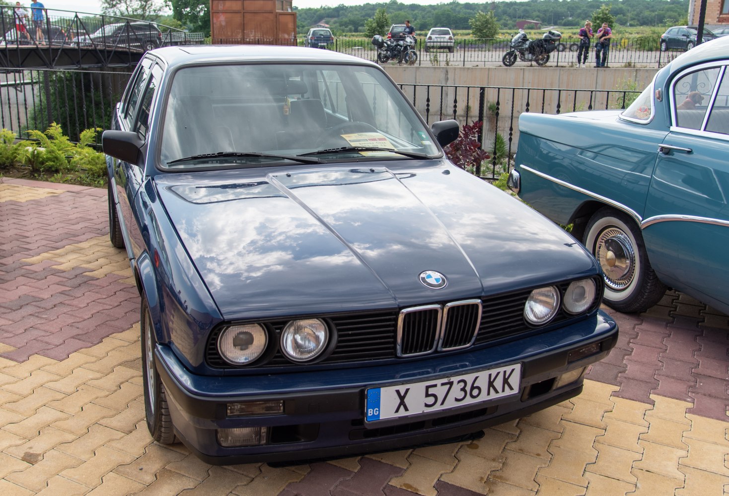 Classic sedan front with quad headlights and kidney grille