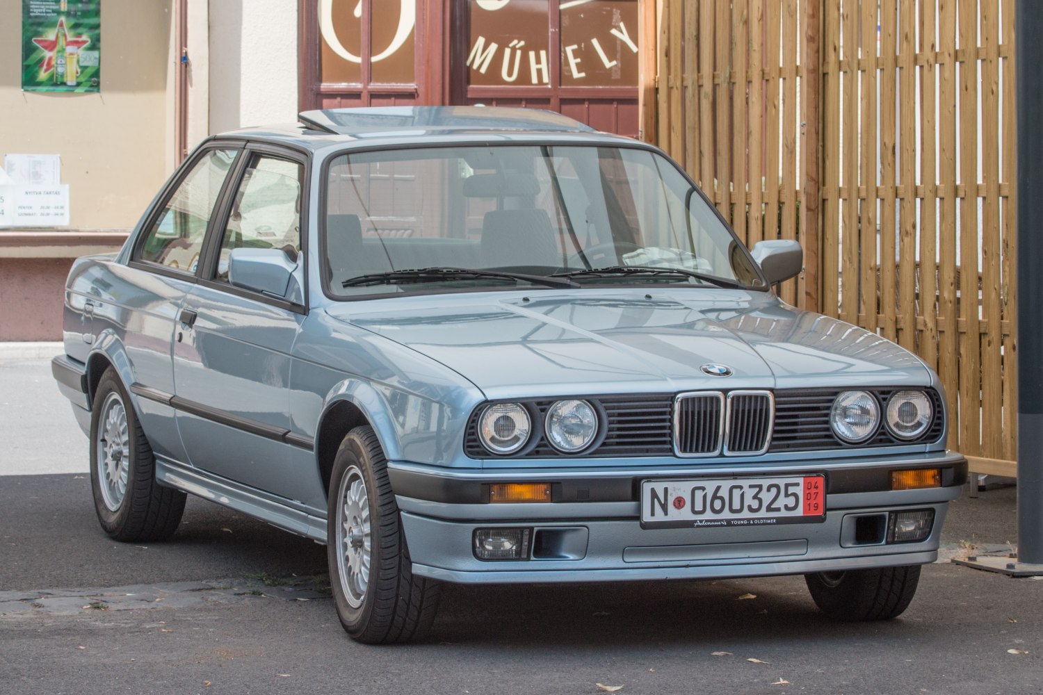 Front and side view with kidney grille and quad round headlights