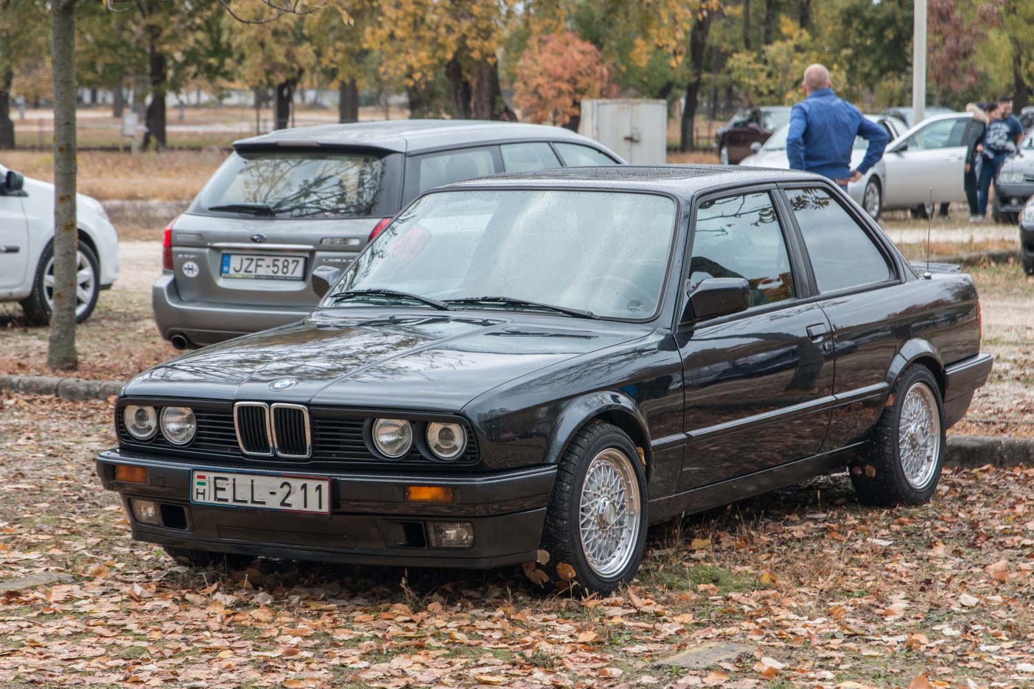 Facelifted E30 coupe front with quad headlights and mesh alloy wheels