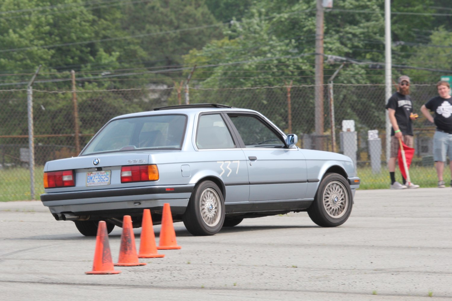 BMW E30 3 Series coupe navigating orange traffic cones