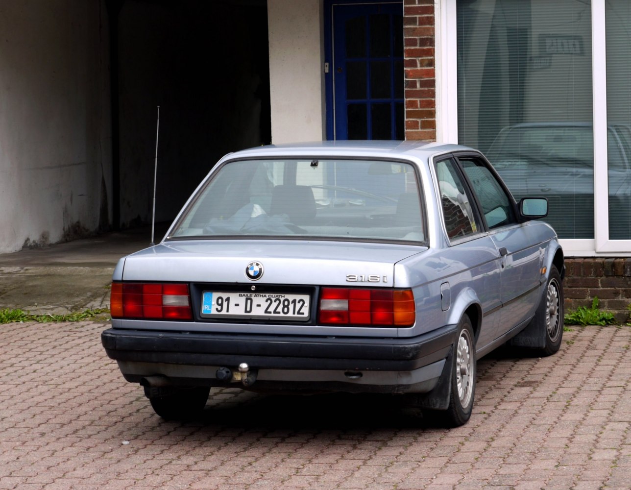 Rear view of a 1987 coupe with taillights and towing hitch