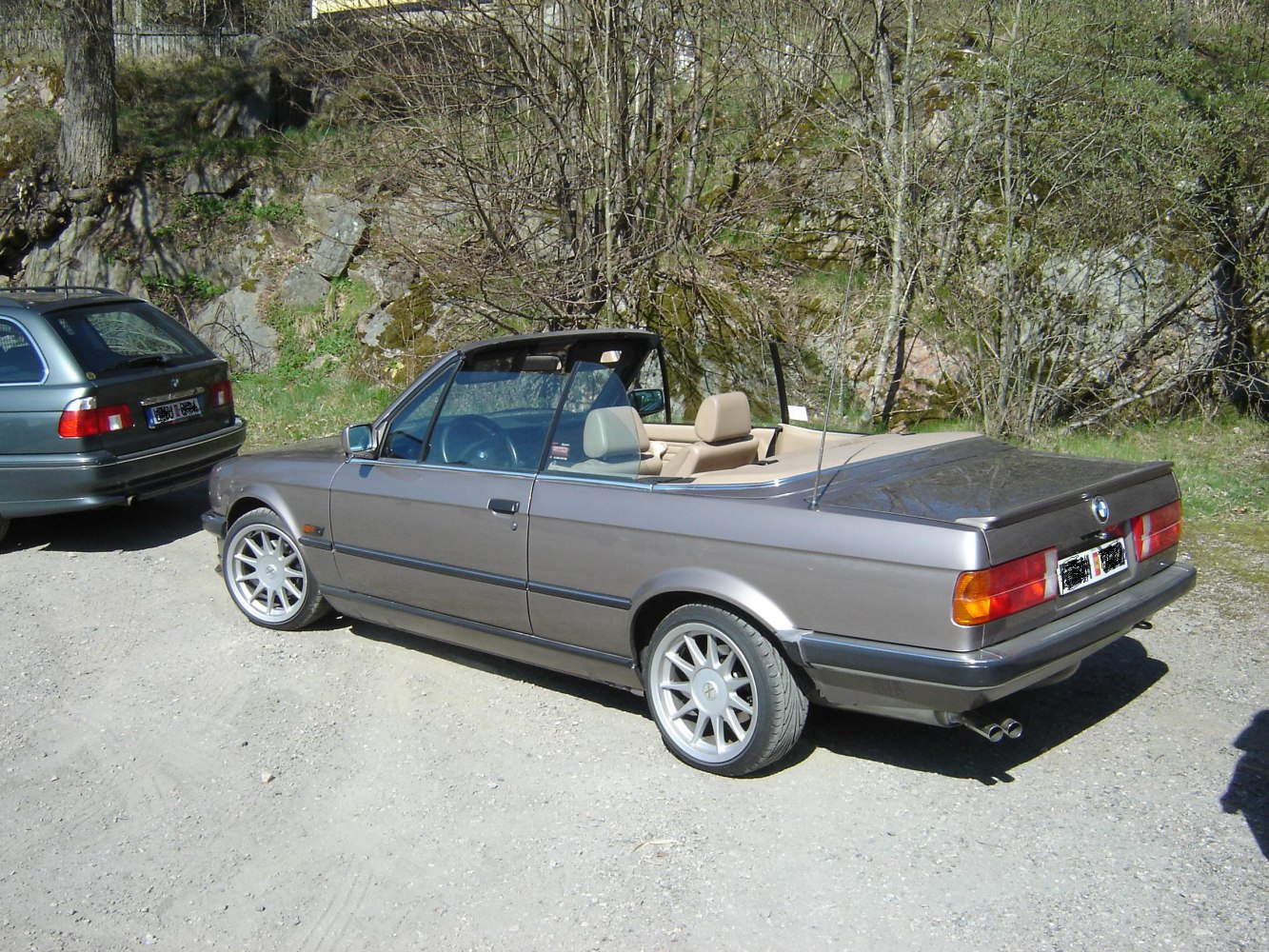 Rear view of a classic convertible with silver alloy wheels