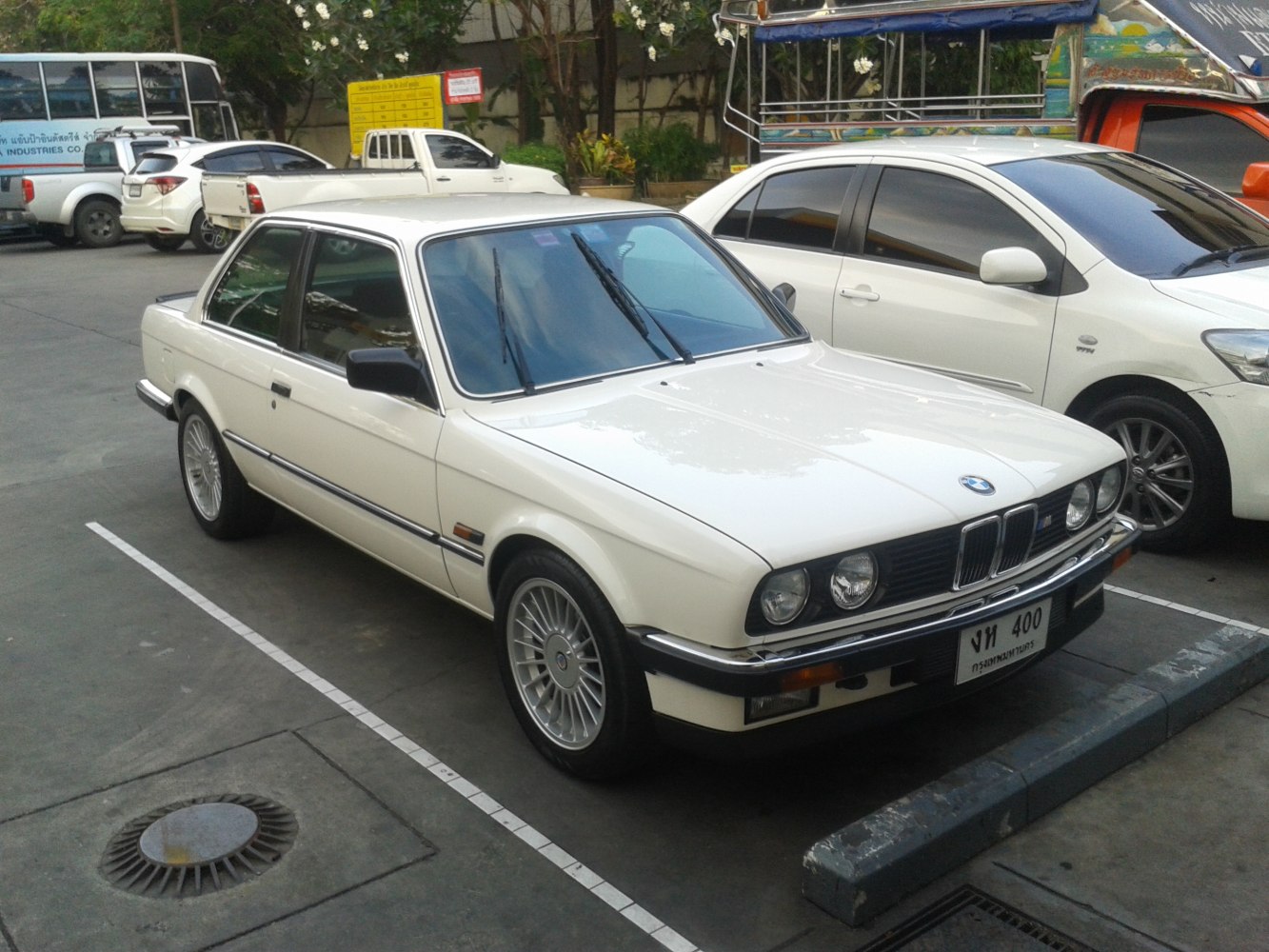 Vintage sedan with quad headlights and alloy wheels