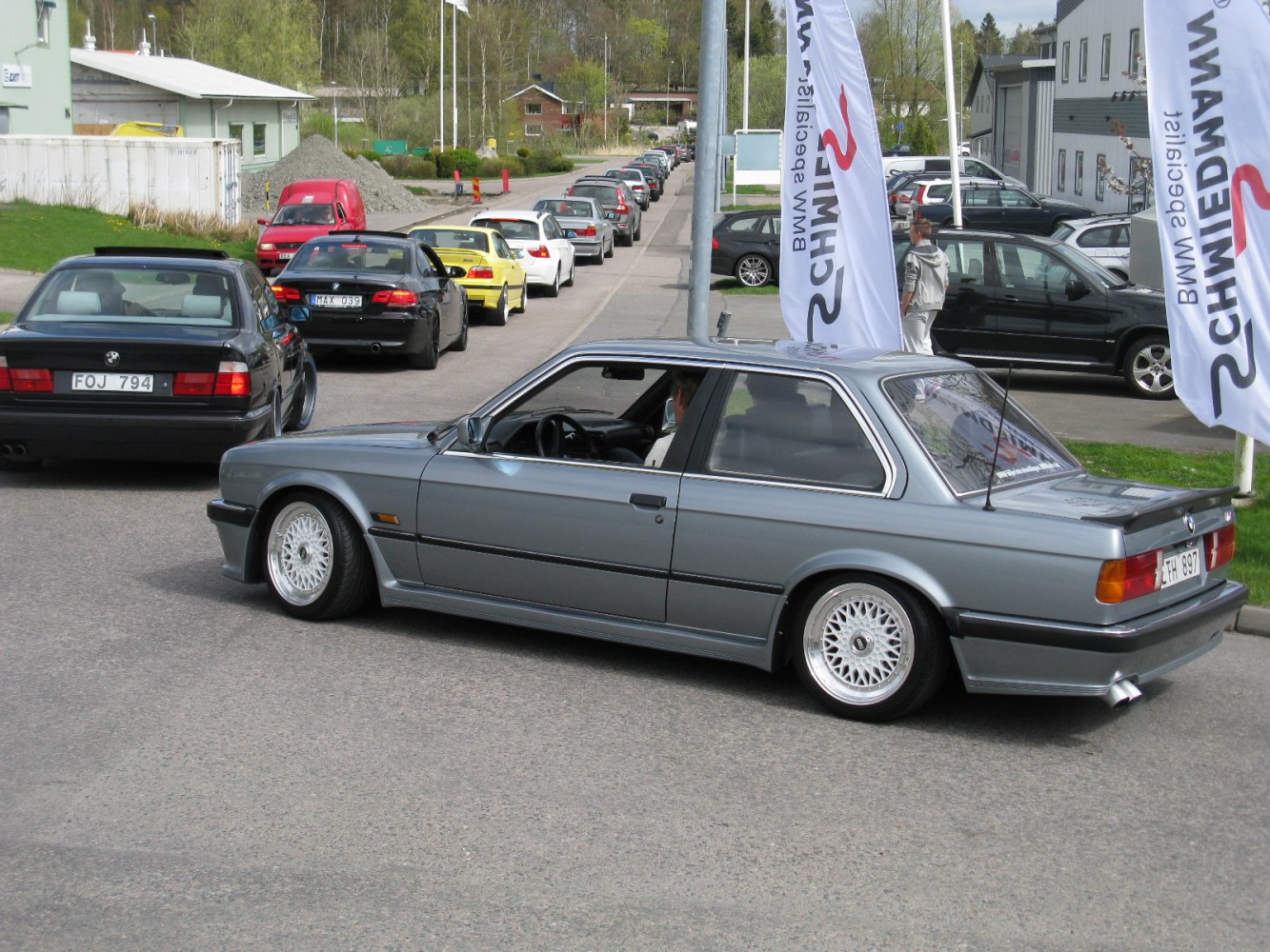 Silver coupe with mesh wheels and sporty vintage design