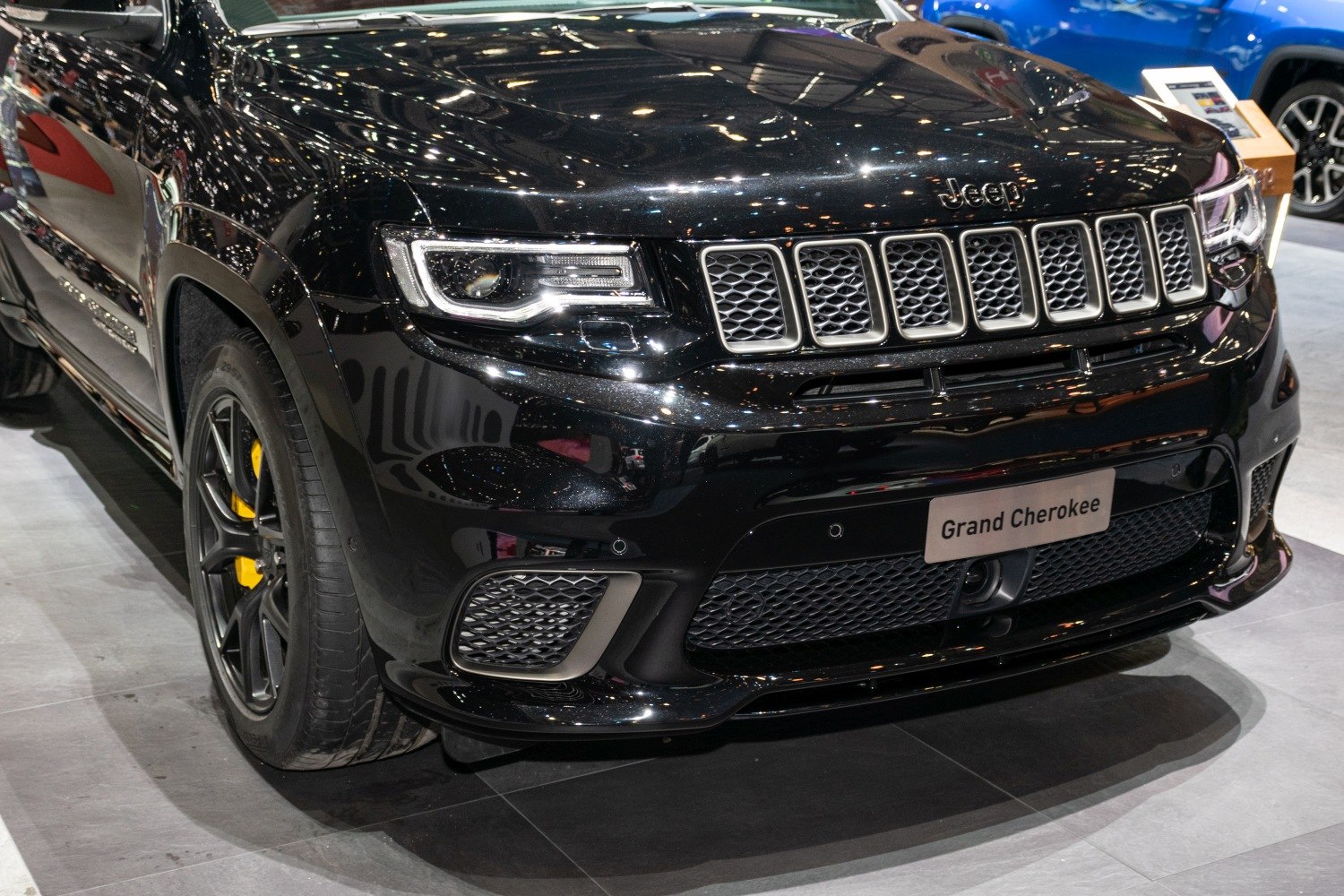 Close-up of Jeep SUV front grille and modern LED headlight