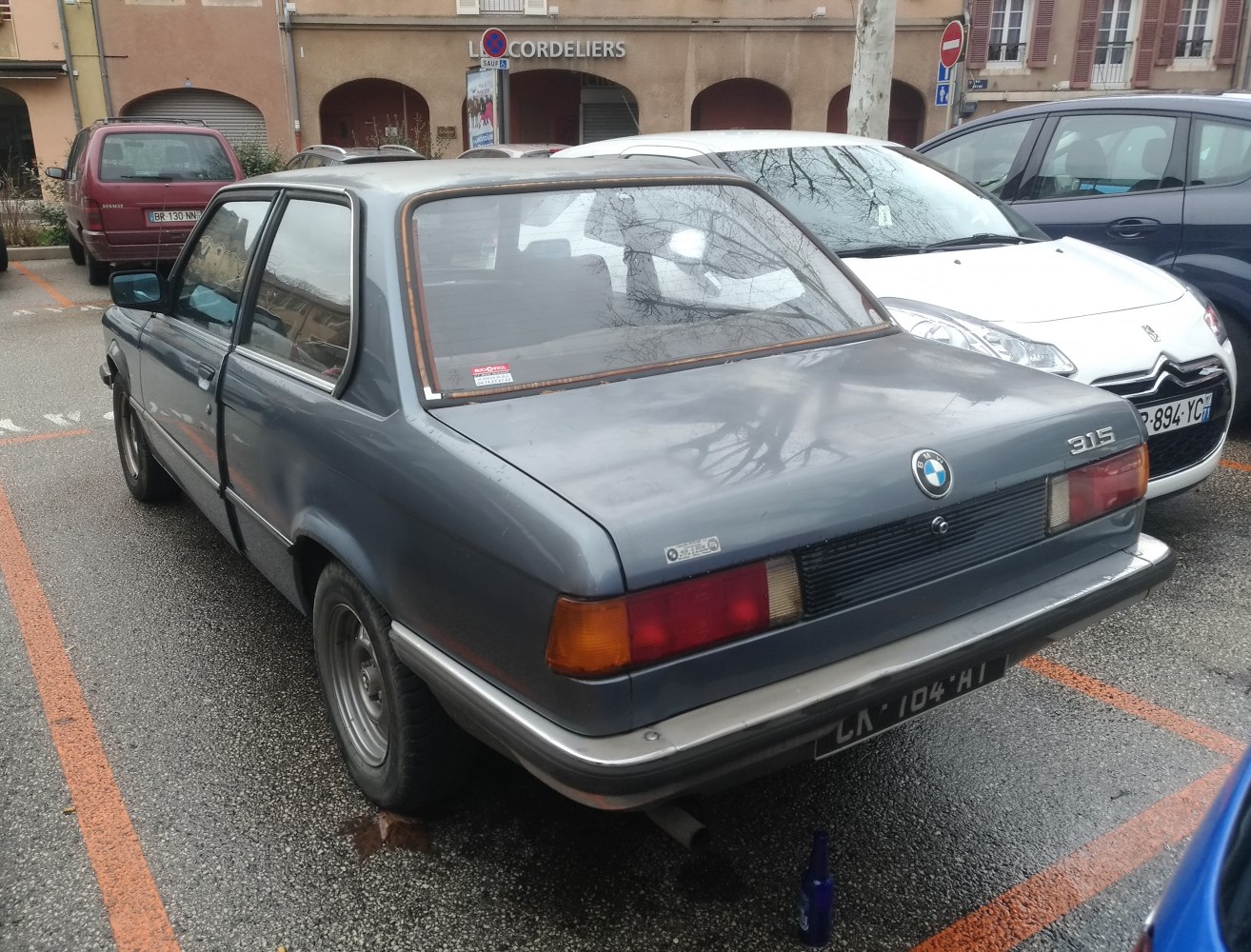 Rear view of vintage 1975 BMW 3 Series E21 with classic tail lights and sedan shape
