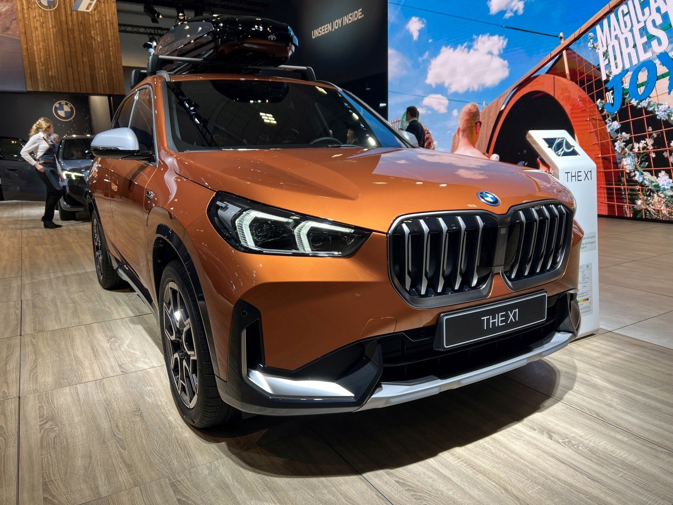 Close-up of front grille and LED headlights with daytime running lights.