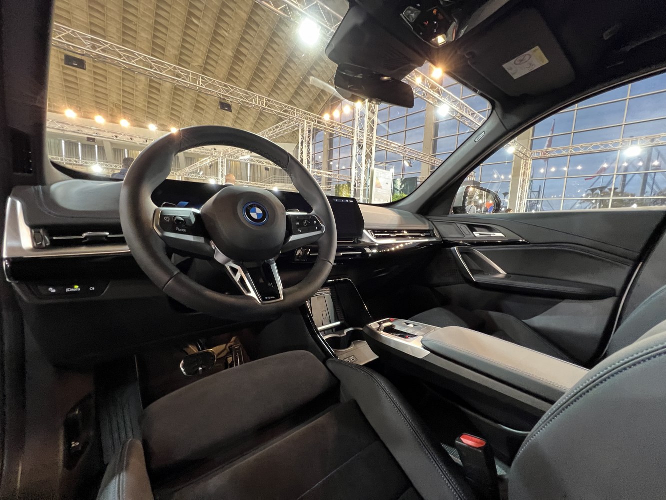 Modern steering wheel and sleek dashboard with infotainment screen inside vehicle