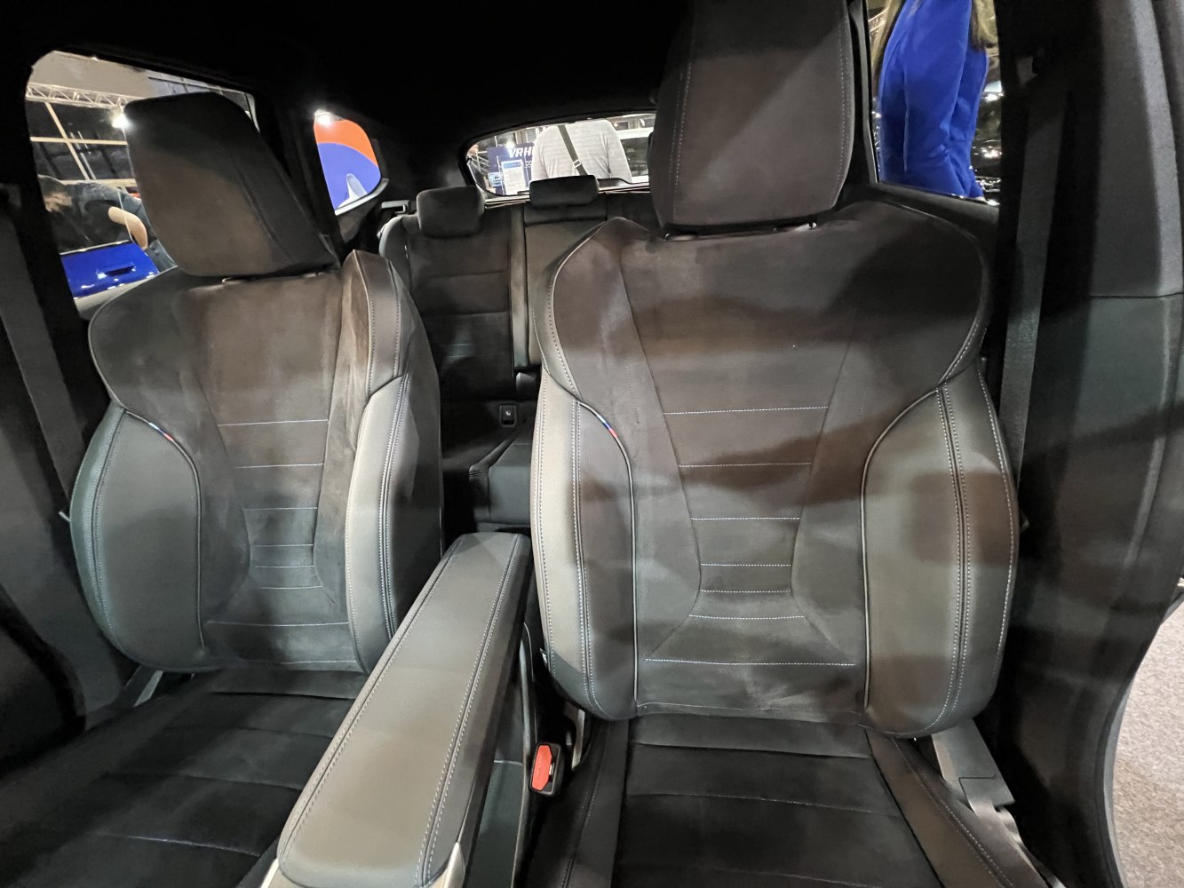 Front leather seats with center armrest in a car interior