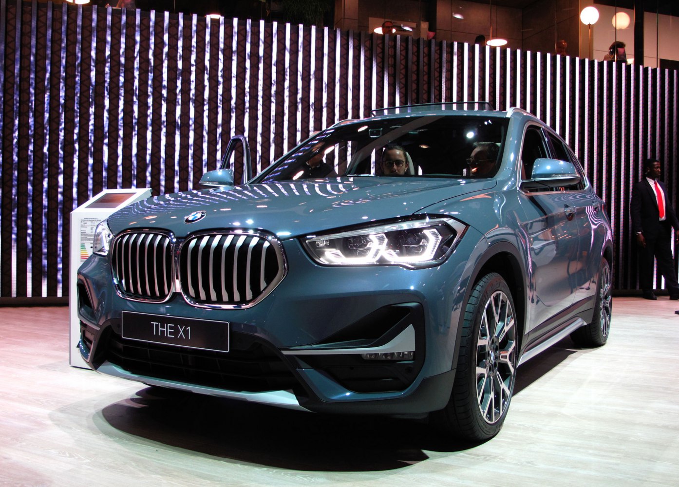 Front view with kidney grille and LED headlights of a blue SUV