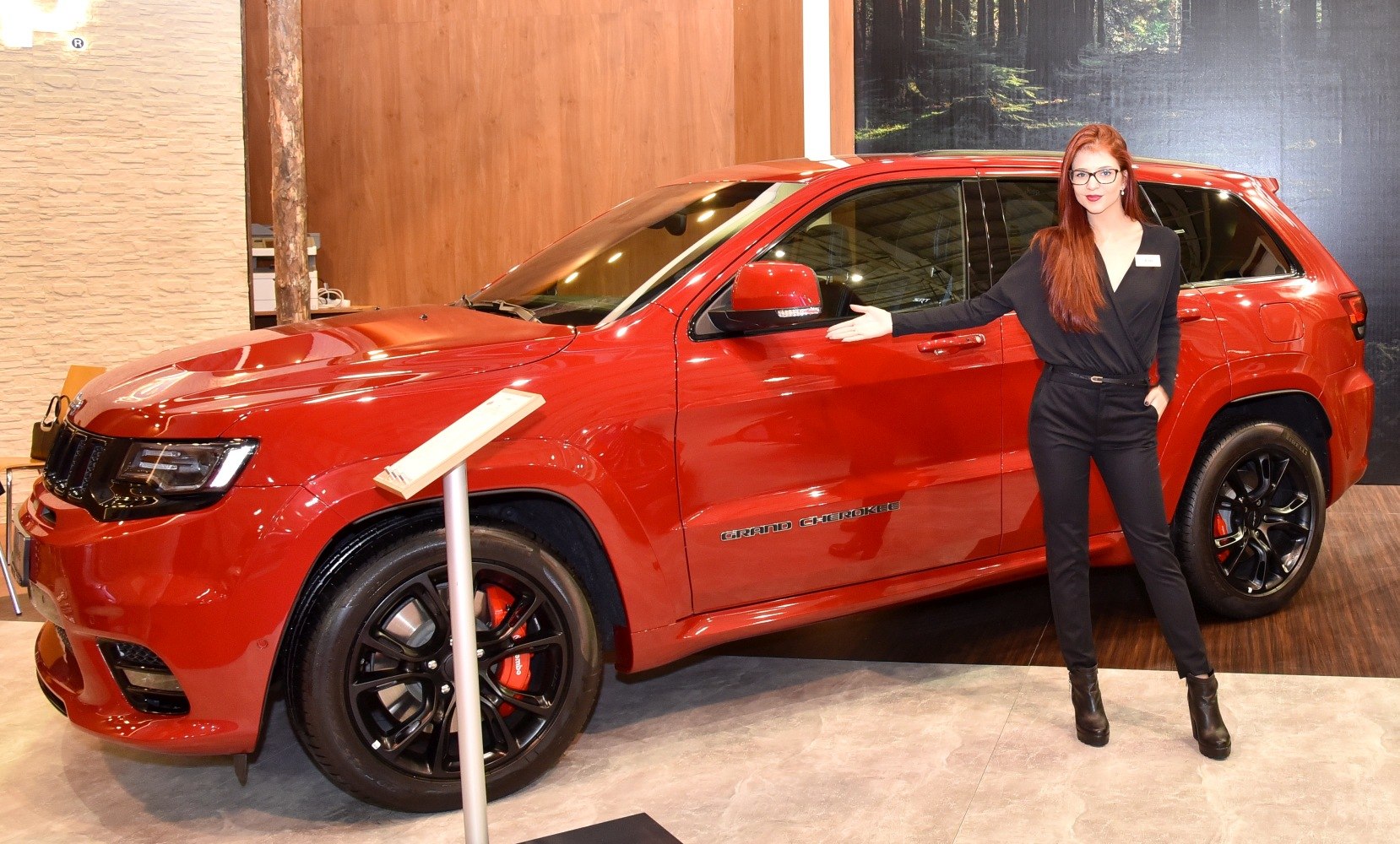 Red SUV with black alloy wheels and red brake calipers