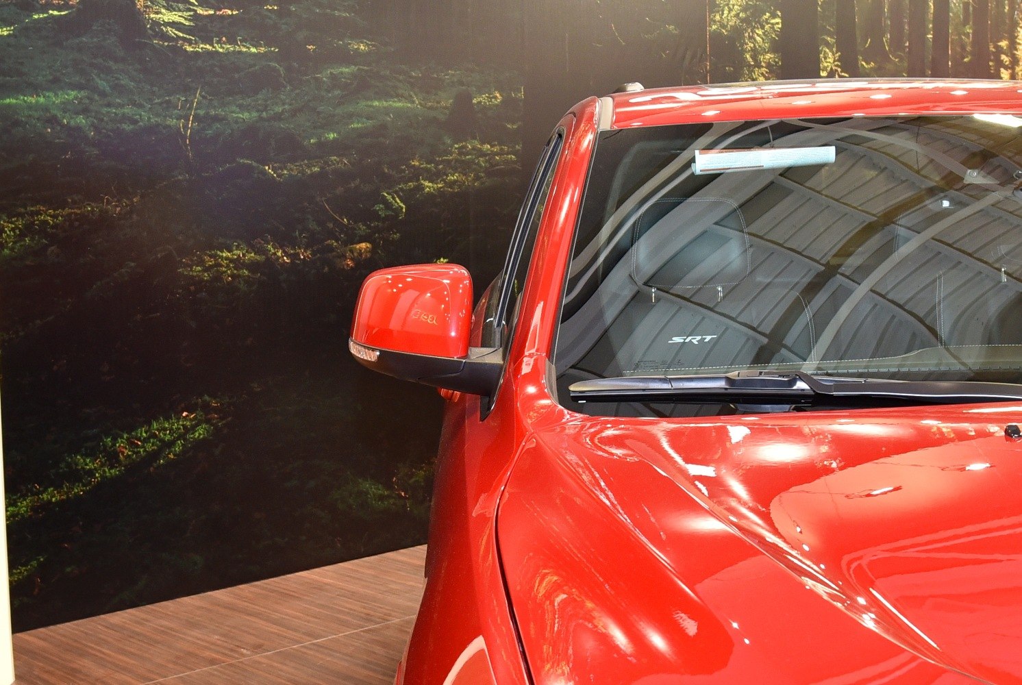 Red SUV side mirror with SRT logo seat interior