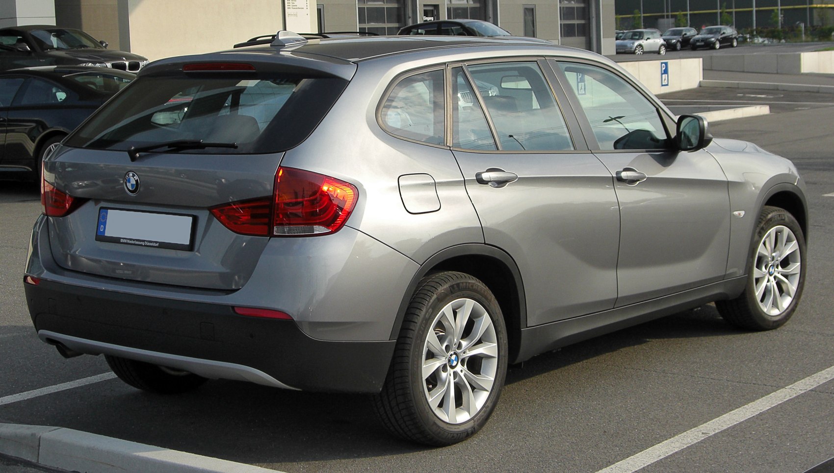 Silver compact SUV rear side with tail lights and alloy wheels