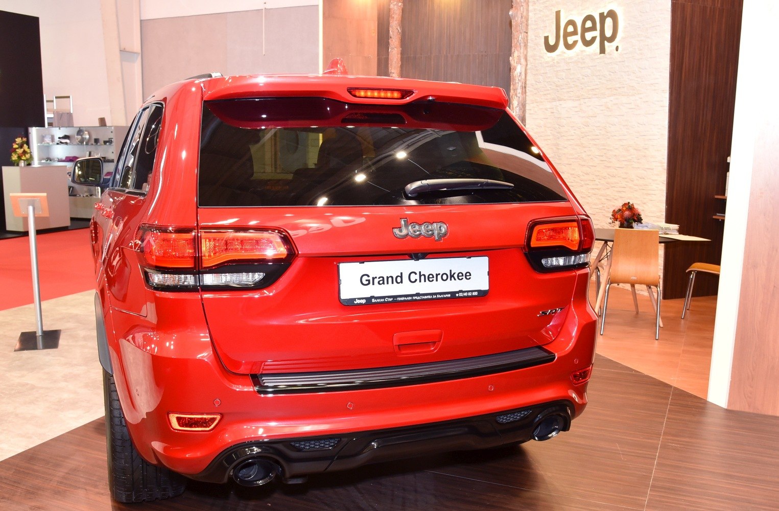 Rear view with distinctive taillights and dual exhaust pipes