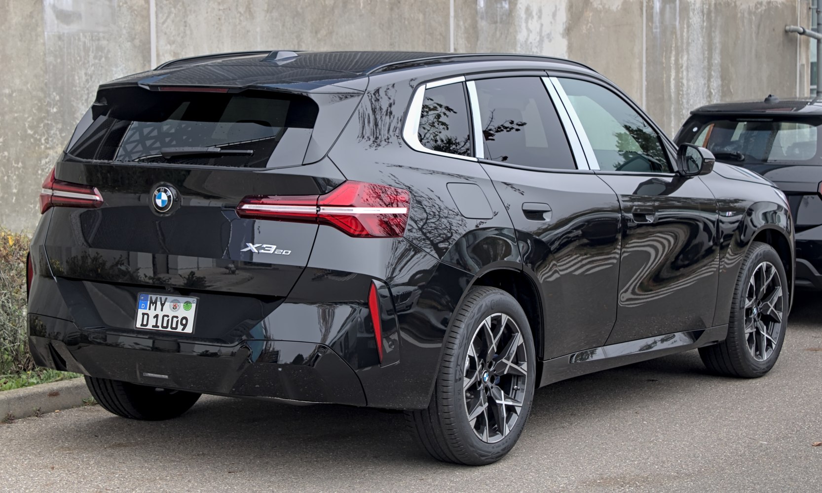 Rear and side view with LED tail lights and alloy wheels.