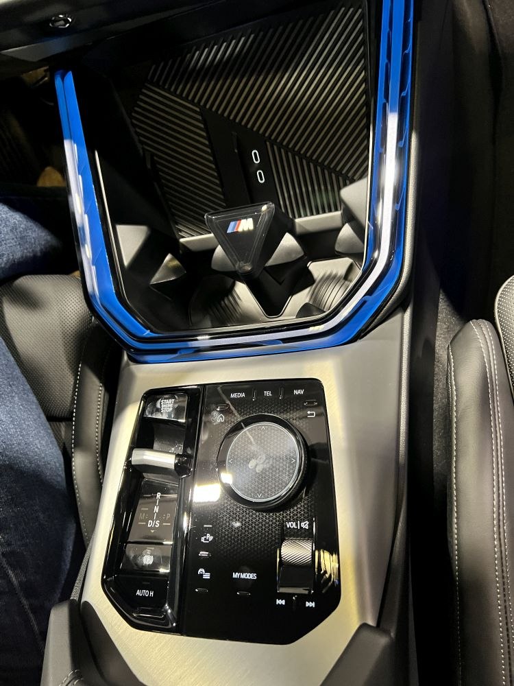 Center console with M gear selector and multimedia control panel.