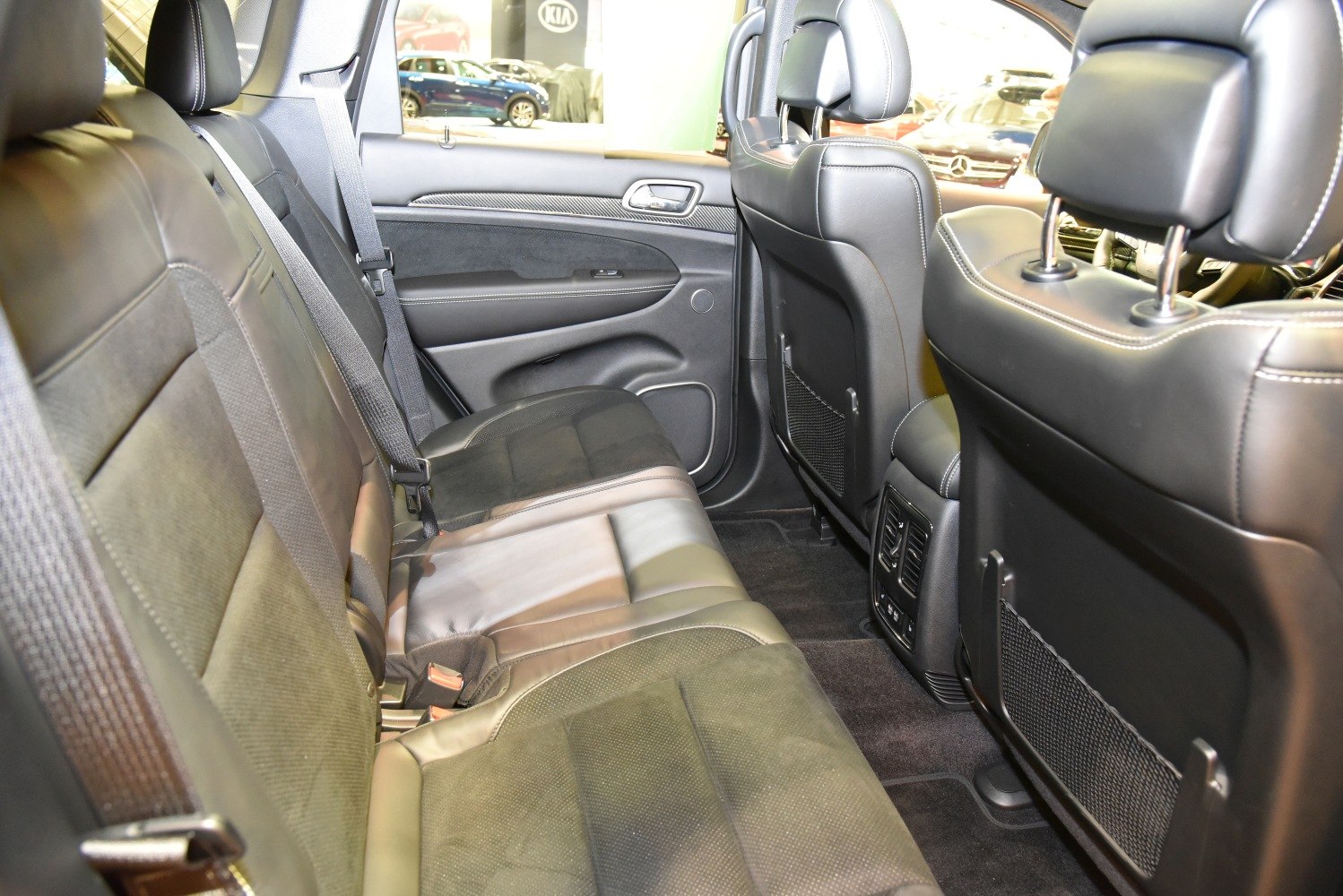 Rear leather seats with climate control vents and spacious legroom.