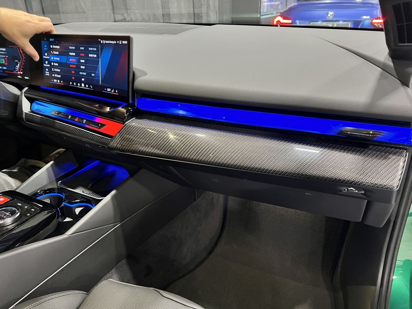 Modern dashboard with touchscreen and blue ambient lighting