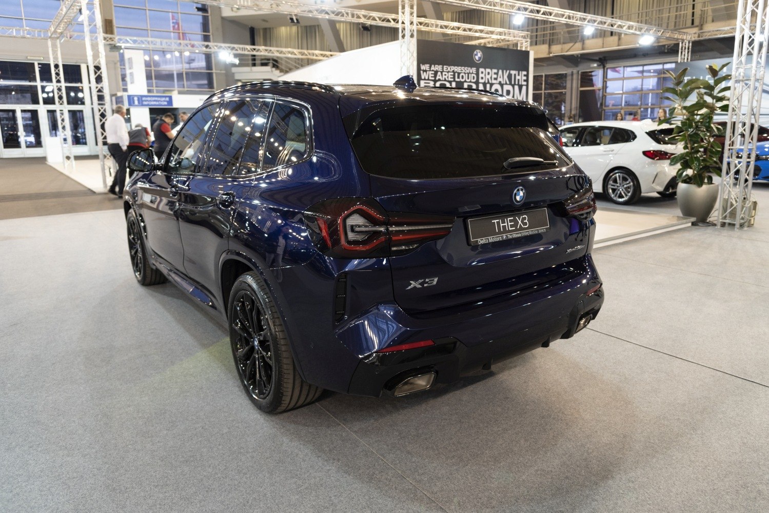 Rear view with distinctive taillights and dual exhaust pipes