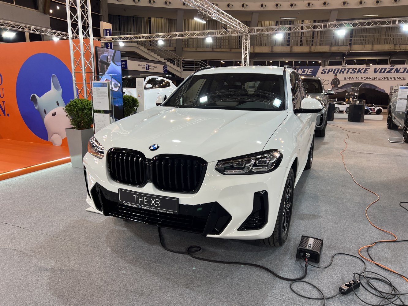 White SUV front with kidney grille and sleek LED headlights