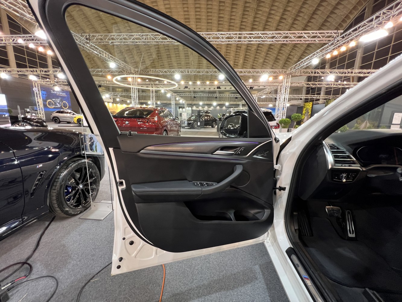 Interior driver side door panel with controls and pedal area
